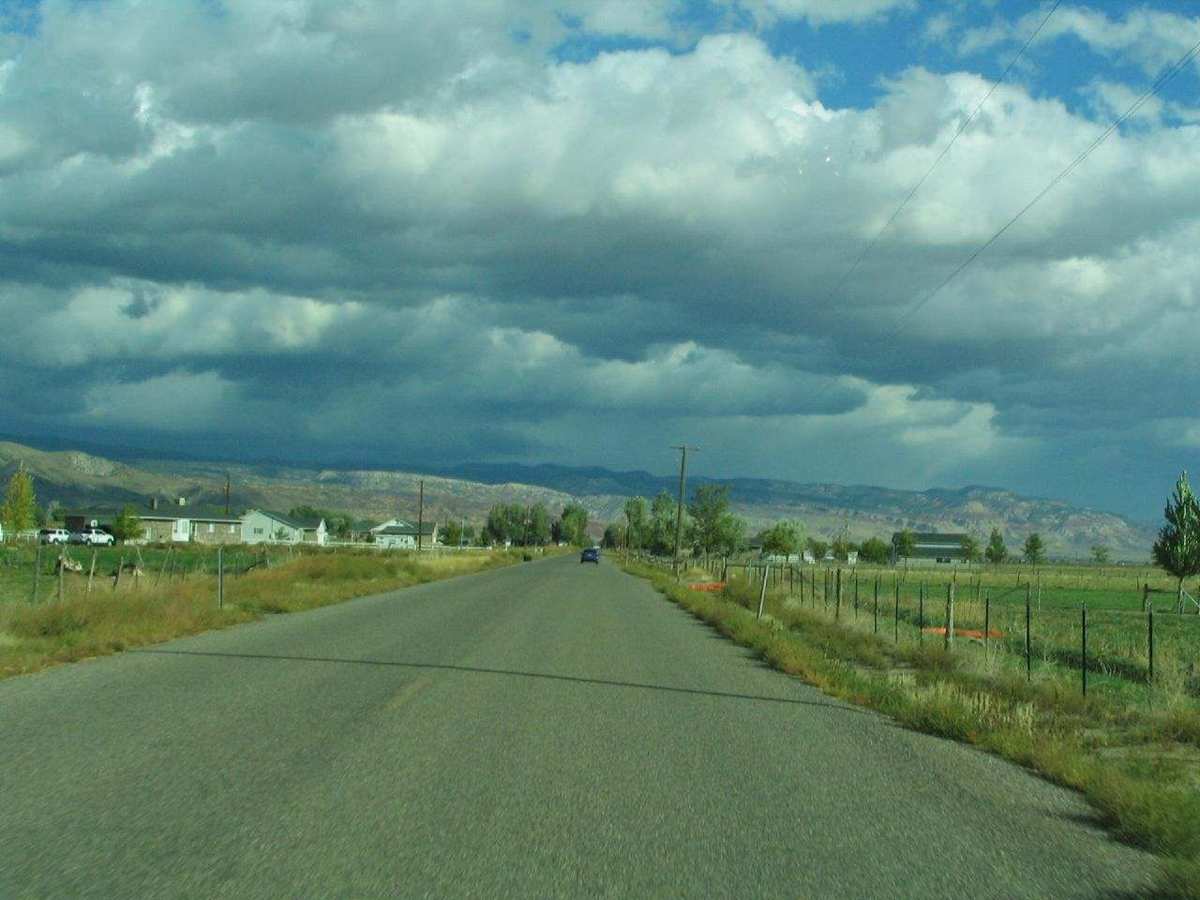 The road into Annabella, Utah, under storm clouds