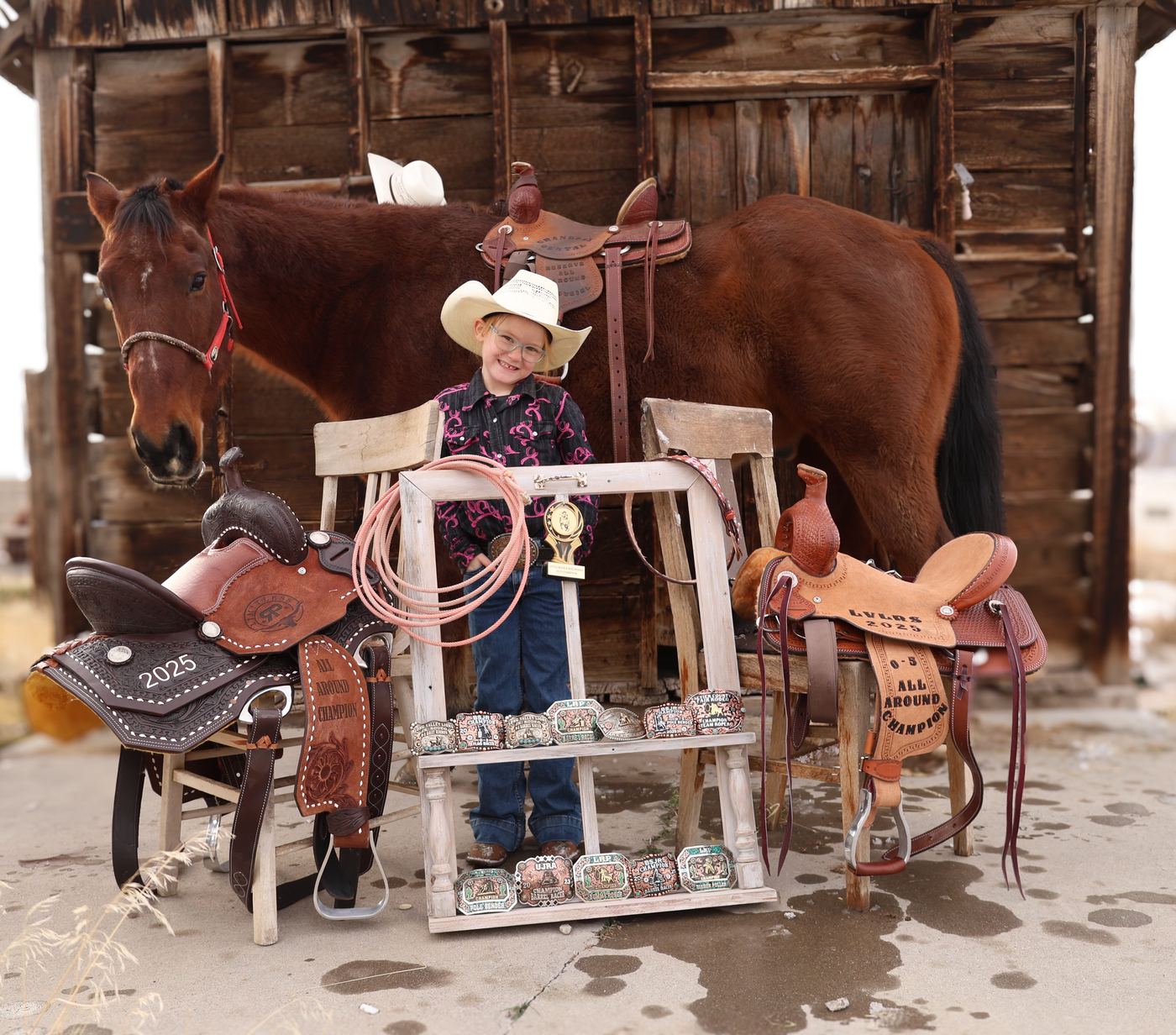 Reinsley, five, with Idaho and her 2025 saddles and buckles