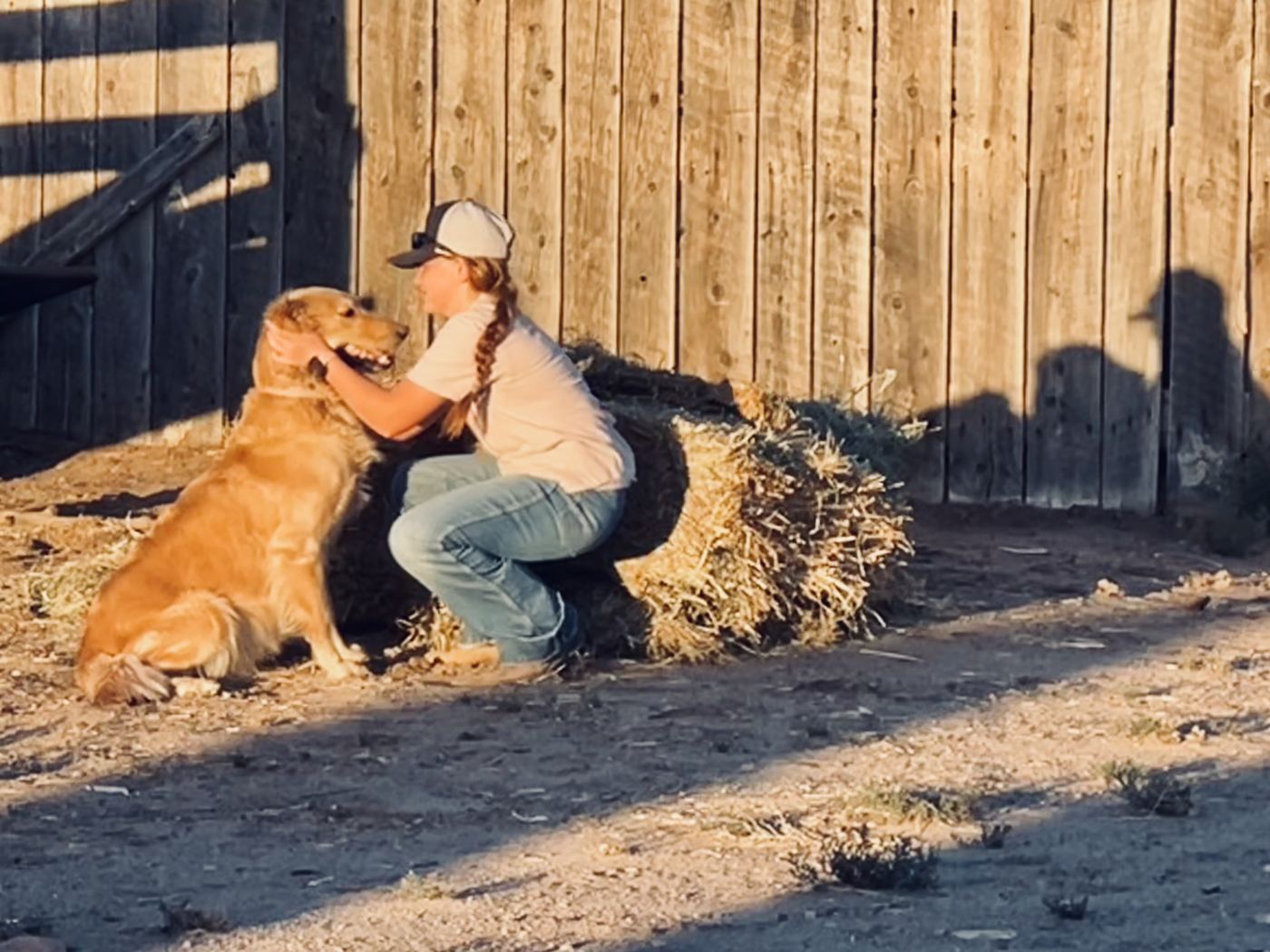 Sparkle getting a hug at the ranch, hours before her puppies came